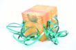 green ribbon and colorful box