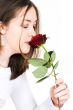beautiful girl smelling rose
