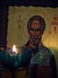 The slavic St Nicolay Icon and burning candle