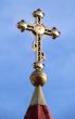 Orthodox Church`s Cupola Cross upon blue sky