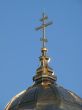 Orthodox Church`s Cupola Cross upon blue sky