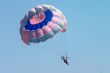 man flying on parachute