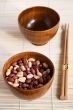 Two wooden noggins and chopsticks