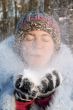 Girl blowing the snow