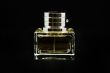Bottle of perfume over black background