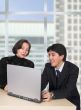 business couple with laptop in the office