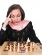 business woman planning her next move - chess