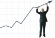 business man pushing graph up - JE