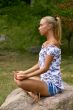 pretty blonde girl meditating
