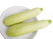 Two green young vegetable marrows