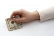 Hand offering money