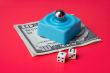 dices and marble steel over ten dollar bill