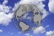 Earth globe over blue sky