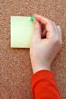 placing note in the cork board