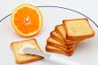 Toast with butter and half orange