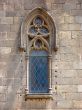 Ancient window of a cathedral . Barcelona