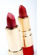 Two tubes of red lipstick