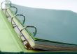 Binder closeup with files stacked