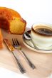 sponge cake with the cup of coffee and spoon