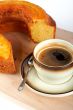 sponge cake with the cup of coffee and spoon