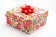 Gift box with red ribbon, on white background