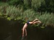 Boy jumping from the bridge