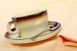 Close-up of a cup of coffee with the spoon