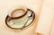 Close-up of a cup of coffee with the spoon