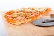 Detail of slices Italian pizza and cutter