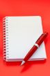 White notebook and pen