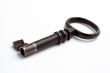 Old key on white background