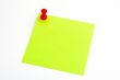 Isolated green paper with red pushnail
