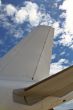 Airplane detail on cloudy sky