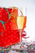 Champagne glass with red shopping bag