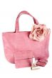 Assortment of pink handbags and lipstick