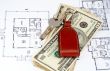 Key and money on home plan