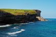 Green meadow on cliffs
