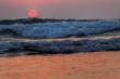 red sunset on waves, atlantic coast