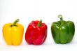 three bell peppers on white