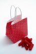 Red shopping bag and pieces of red licorices