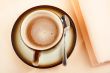 Close-up of a cup of coffee with the spoon