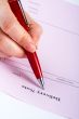 Writing blank delivery note with pen