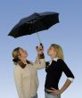 2 women under the umbrella