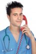 doctor speaking on the telephone