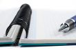 Detail of pen and blank notebook sheet