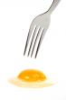Fork above the raw egg