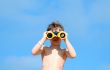 child with spyglasses