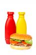 Burger with mustard and ketchup bottles