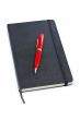 Black notebook and pen