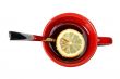 Red cup of tea with lemon and the spoon
